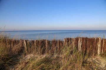 Naklejka na ściany i meble Baltic Sea beach near Heidkate at golden hour, Germany