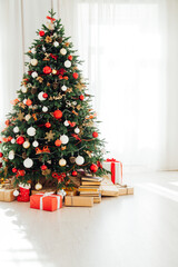 Christmas tree by the window interior of the room New Year holiday gifts