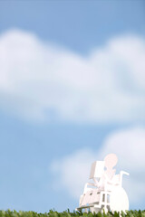 Obraz premium ペーパークラフトの車椅子と人