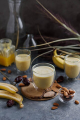 Banana smoothie with almond milk and honey. Healthy eating. Vegan drink.