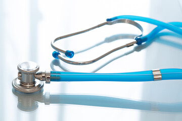 Stethoscope or phonendoscope a blue background.