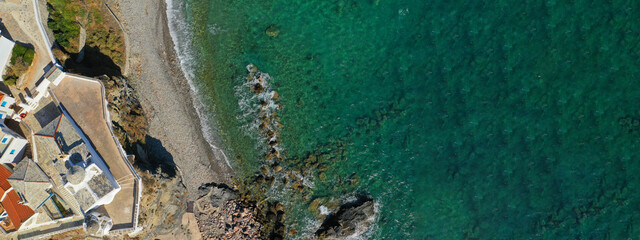 Aerial drone ultra wide panoramic photo of beautiful main town and port of Skopelos island...