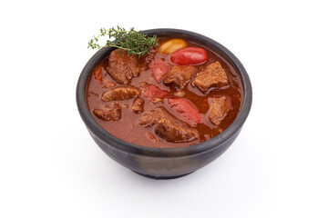 Beef goulash soup, isolated on white background