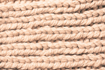 Pink pastel knitting texture macro view. Warm woolen background for winter time.