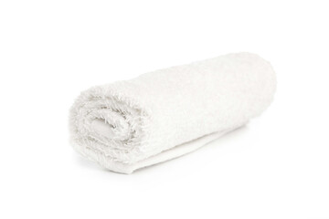 Fototapeta na wymiar one white new towel rolled up on a white background