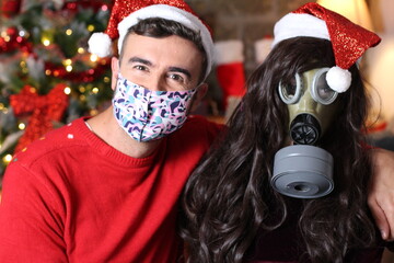 Couple wearing protective masks during Christmas 
