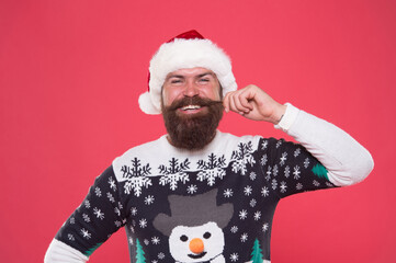 Express positivity. happy bearded whiskered man in santa hat. new year party fun. celebrate winter holidays. merry christmas. man in funny knitted sweater. xmas shopping time. male winter fashion