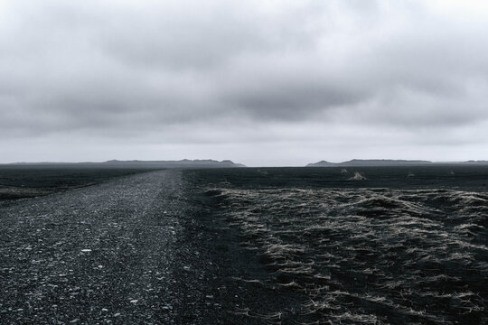 Skei&eth;ar&aacute;rsandur black volcanic sand sandur on  a stormy day
