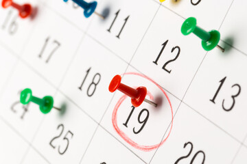 Push pins on calendar. Idea concept of to do planning.