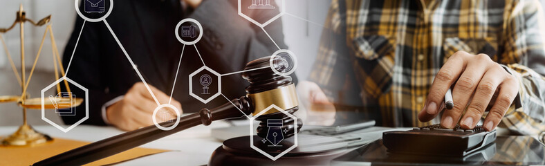 justice and law concept.Male judge in a courtroom on wooden table and Counselor or Male lawyer working in office. Legal law, advice and justice concept.