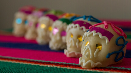 Fototapeta na wymiar A series of traditional mexican Sugar Skulls used as decoration in the festivity of Day of the Dead