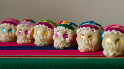 Various real mexican Sugar Skull alingn, used as decoration in the Day of the Dead