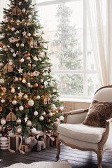 Christmas tree and chair, living room decorated for Christmas. High quality photo