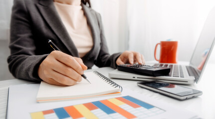 businesswoman hand using smart phone, tablet payments and holding credit card online shopping, omni channel, digital tablet docking keyboard computer at office in sun light