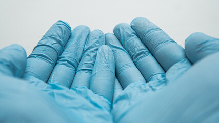 sterilization of hands with protective blue gloves. 
basic defen