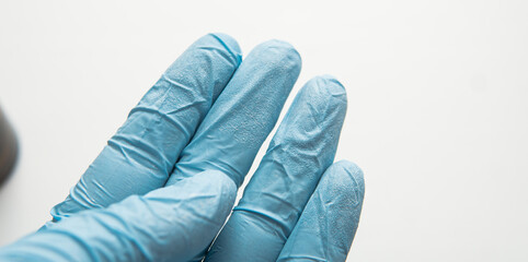 sterilization of hands with protective blue gloves. 
basic defen