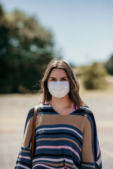 Girl shopping with mask and gloves during covid 19 corona virus crisis