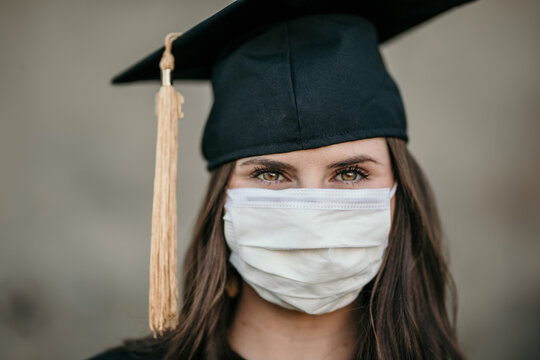Girl Graduate In Graduation Cap And Covid 19 Mask
