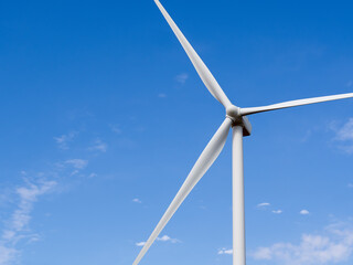 Wind turbine generator view with blades spinning around