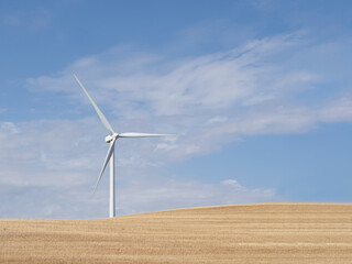 Wind turbine generator view with blades spinning around