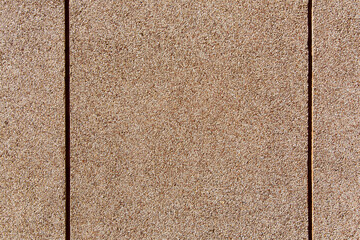 Fototapeta premium wall texture with a granular coating of moisture resistant tar, a close-up of a building facade with copy space, nobody.