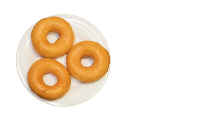 Obraz na płótnie Canvas Three classic sweet donuts on plate isolated on white. The copy space for your text.