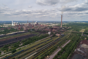 Obraz premium Industrial steel factory, iron works. Metallurgical plant. steelworks. Heavy industry in Europe, Poland, Dabrowa Gornicza. Air pollution from chimneys. Ecology and environmental. Aerial drone view