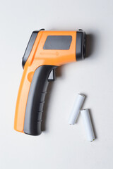 non-contact handheld pyrometer thermometer, yellow. and batteries for it.