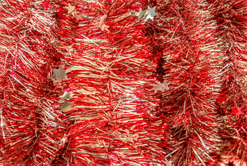 christmas festive background christmas tree red foil garlands close up
