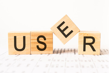 Word user. Wooden small cubes with letters isolated on white background with copy space available.Business Concept image.