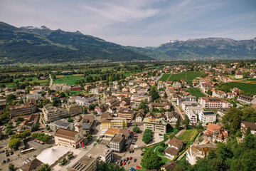 Fototapeta na wymiar Scenic aerial view of the village in Triesenberg , natural border of Liechtenstein, an alpine country in central Europe, to Switzerland. Panoramic Liechtenstein. Aerial view of vaduz. RAW