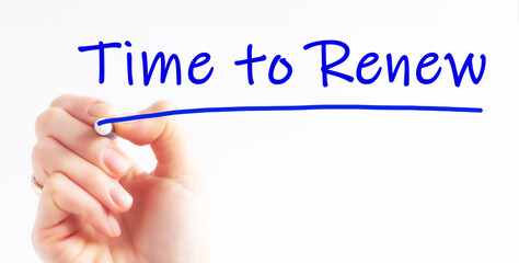 Hand writing inscription Time to Renew with blue marker, concept.