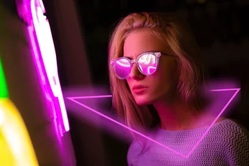 Foto op Plexiglas Neon Portrait. Blonde girl with glasses looking to light © High Stock