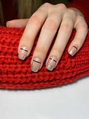 Coated manicure on scarf background