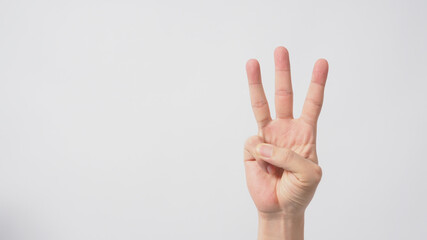 A hand sign of 3 fingers point upward meaning three or third.It put on white background