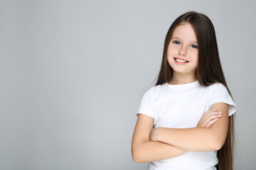 Young girl on grey background