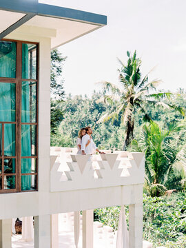 Embracing couple on tropical terrace