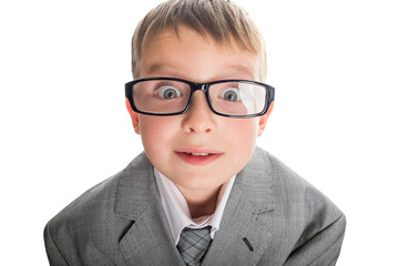 Portrait of a funny child in glasses and a business suit on a white background. Smart child in suit and glasses looking at camera with his big eyes