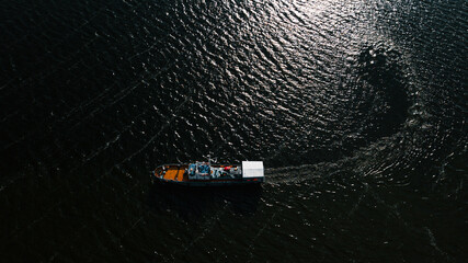 Top-view of a small ship turning