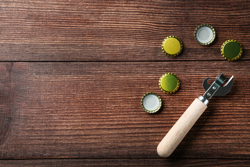 Bottle caps with opener on brown wooden table