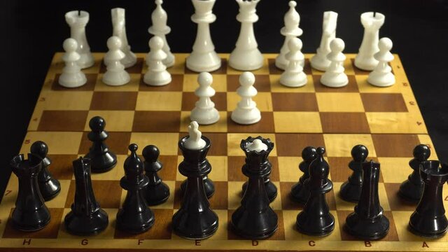 man plays chess with himself playing the debut combinations on the book
