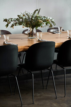 Vase with flowers on banquet table