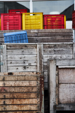 Stack of shabby boxes in port