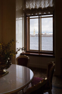 Classic interior in Saint-Petersburg. Window overlooking Neva river.