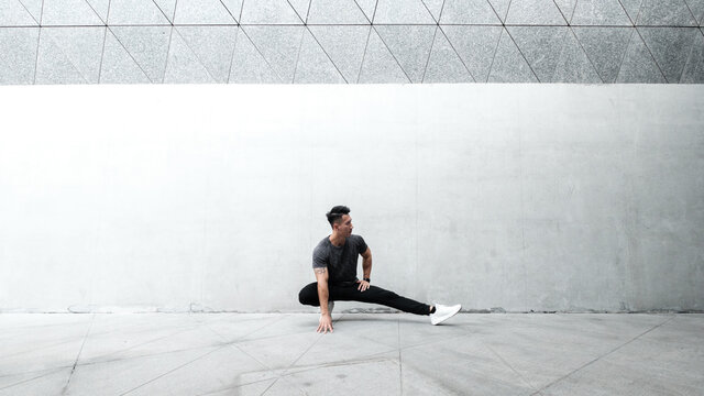 A Chinese man is exercising in the city