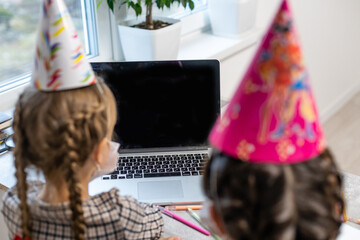 Kids online birthday party. Little girls in dresses, hat celebrate holiday with friends....