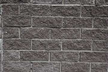 the texture of a concrete gray wall blocks like brick