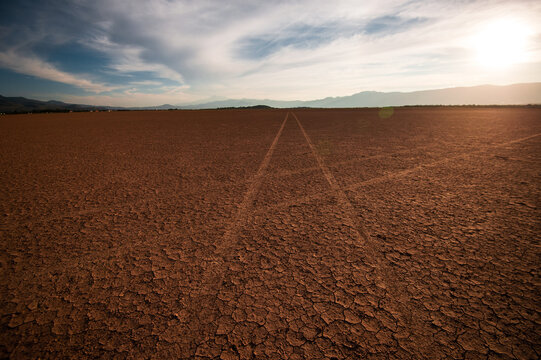 Death valley and two car traces crossing