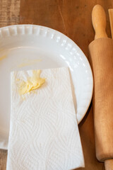 baking background greasing a pie dish 