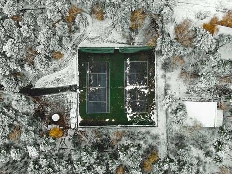 Aerial view of tennis court covered with snow